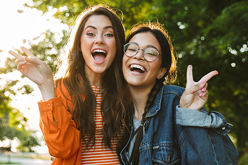 Two young girls at a local park in Moorhead, Minnesota after earning $100 from Gate City Bank by opening a checking account