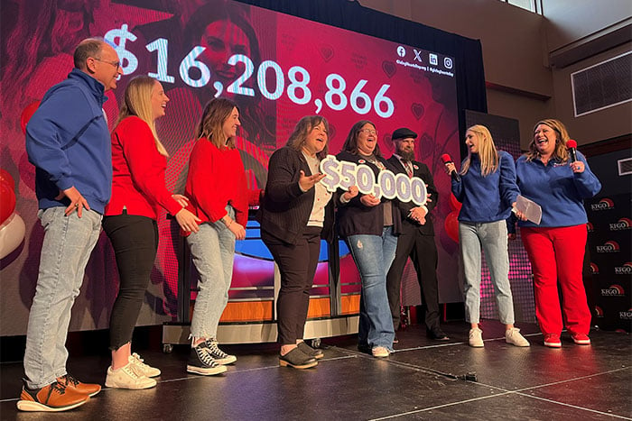 Gate City Bank team members surprise representatives of Rape and Abuse Crisis Center with a $50,000 Giving Hearts Day gift