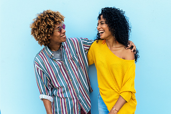 a happy couple exchanges smiles after learning tips for retirement planning in your 40s from Gate City Investment Services