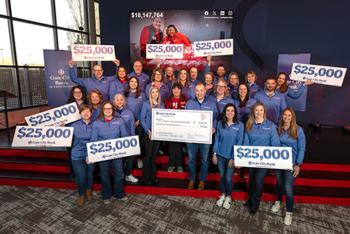 Gate City Bank team members present a large check to Heart-n-Soul Community Café, which won the $25,000 Giving Hearts Day nomination contest