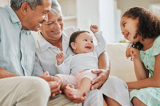 grandparents play with grandkids after learning tips for retirement planning in your 60s from Gate City Investment Services