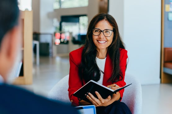 Commercial relationship banking officer from Gate City Bank, sitting down to talk with a local business owner in Fargo, ND.