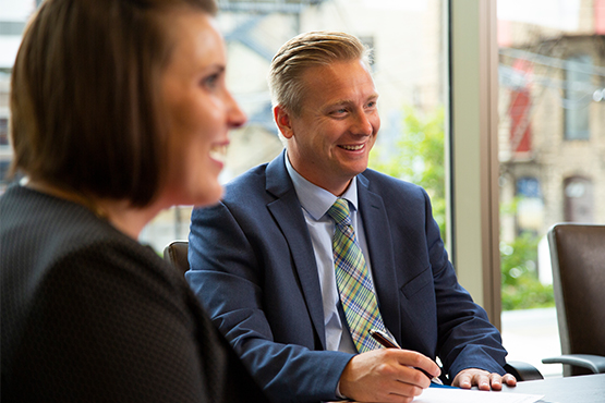 smiling gate city bank team members work together to bring customers the best in business lending