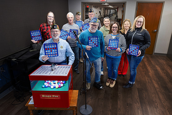 A group photo of American Legion members and Gate City Bank team members, who helped fund a new bingo machine at Luther Memorial Home in Mayville, ND.