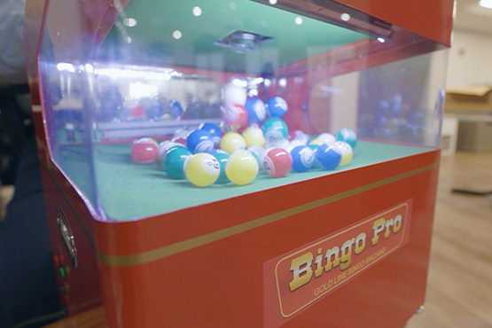 Colorful balls bounce around a new bingo machine Gate City Bank helped fund at Luther Memorial Home in Mayville, ND.